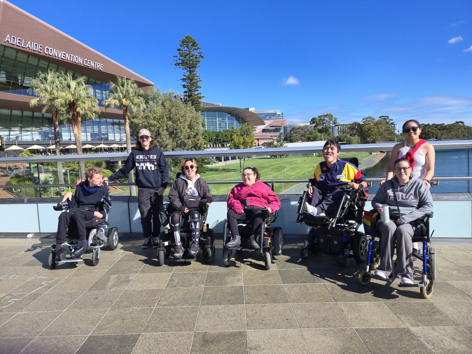 Pathfinders group smiling together in front of the Adelaide Convention Centre